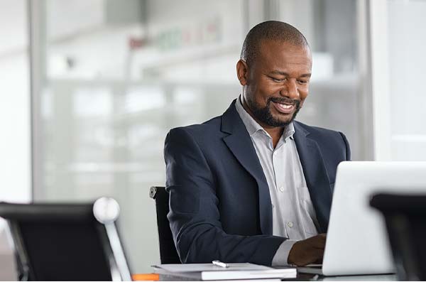 man checking account from computer at work